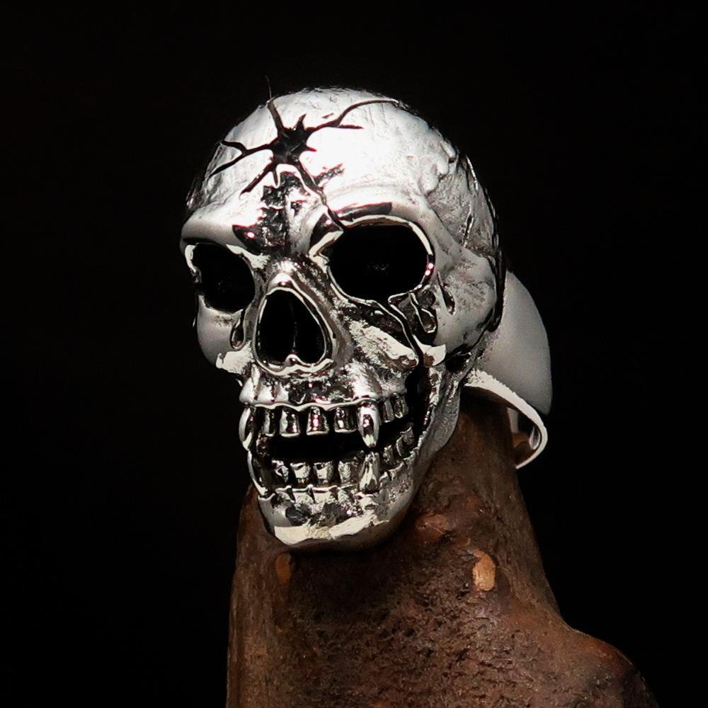 Men's antiqued head shot skull ring made of solid sterling silver, featuring a unique design and high polished accents.