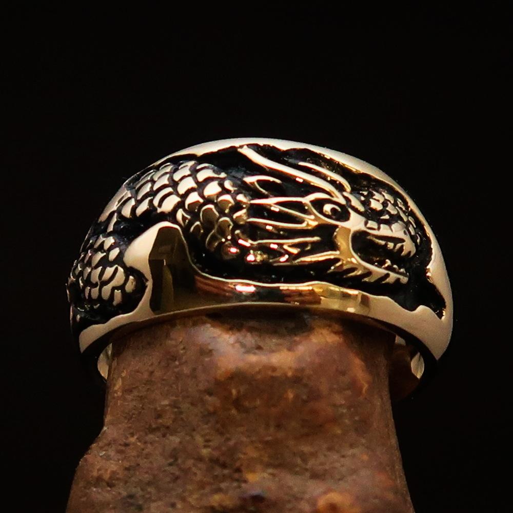 Men's Band Ring featuring a detailed dragon and snake design, crafted from solid brass with a high polished and antiqued finish.