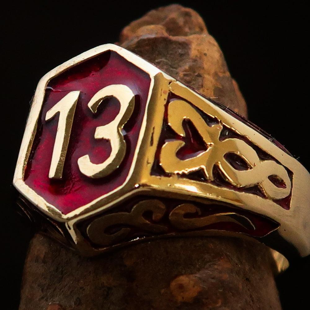 Men's Biker Ring Number 13 made of solid brass with a polished finish and red enamel, showcasing its unique design and craftsmanship.