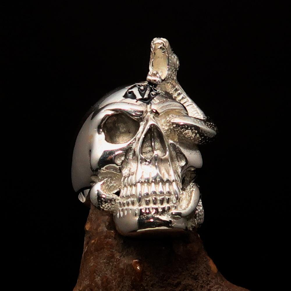 Men's black 1% Snake Skull Outlaw Ring made of sterling silver with black enamel finish, showcasing intricate skull design.