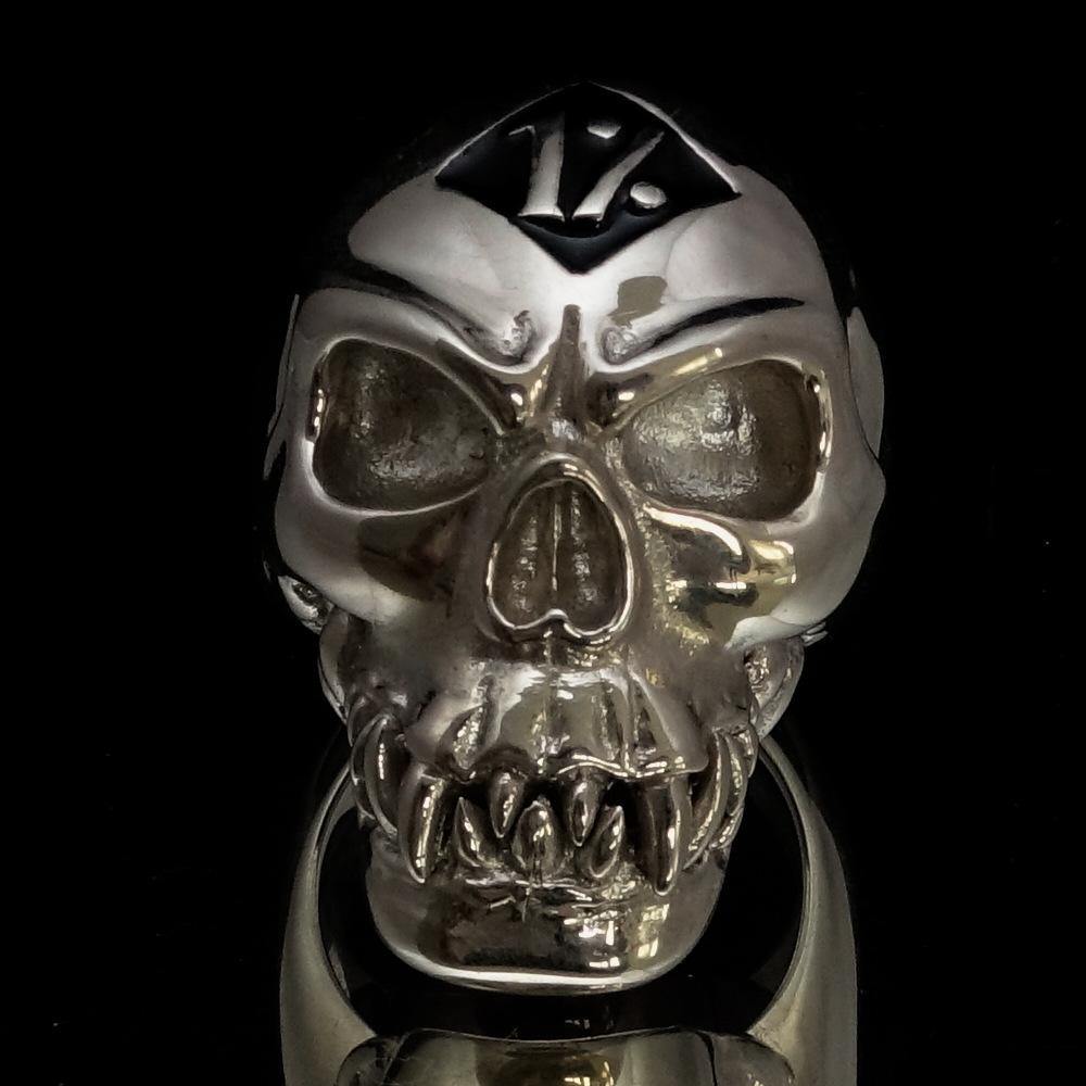Men's black 1% Zombie Skull Outlaw Ring made of sterling silver with black enamel detailing, showcasing a bold skull design.