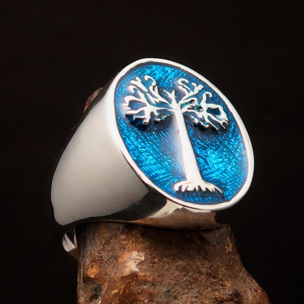 Men's blue oval Tree of Life ring made of high polished sterling silver with blue enamel, showcasing intricate design and quality craftsmanship.