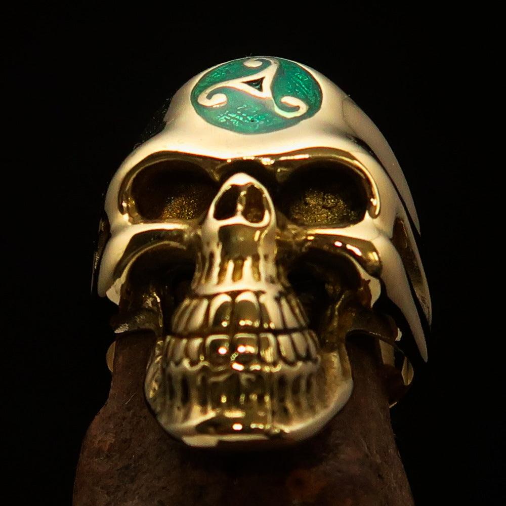 Men's Celtic Triskelia Triad Skull Ring made of solid brass with green enamel finish, showcasing intricate Celtic design.