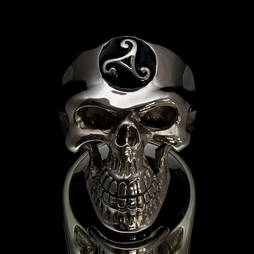Men's Celtic Triskelia Triad Skull Ring in solid sterling silver with black enamel finish, showcasing intricate design and polished surface.