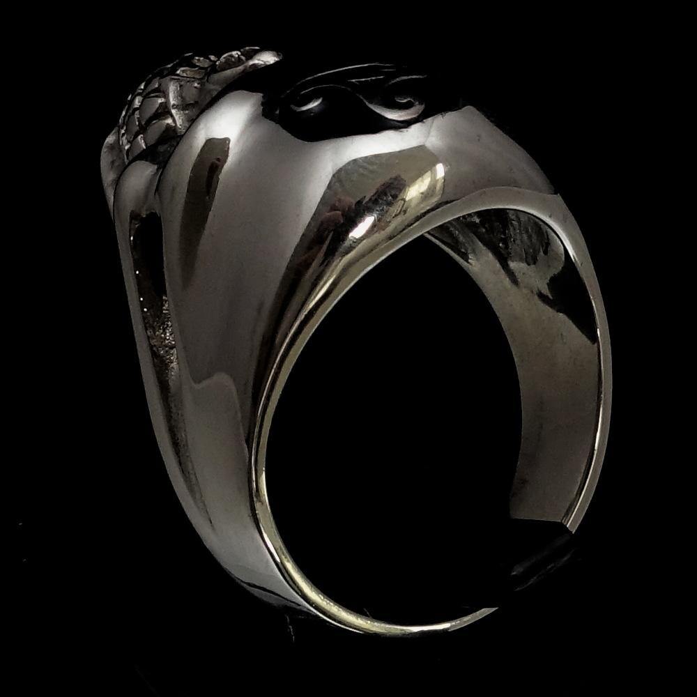 Men's Celtic Triskelia Triad Skull Ring in solid sterling silver with black enamel finish, showcasing intricate design and polished surface.