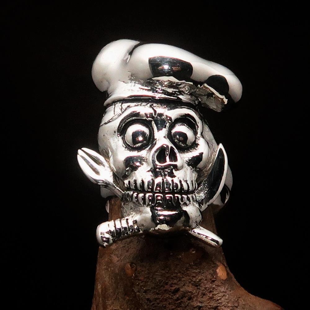 Men's Chef Skull Ring made of sterling silver featuring crossed knife and fork design, polished and antiqued finish.