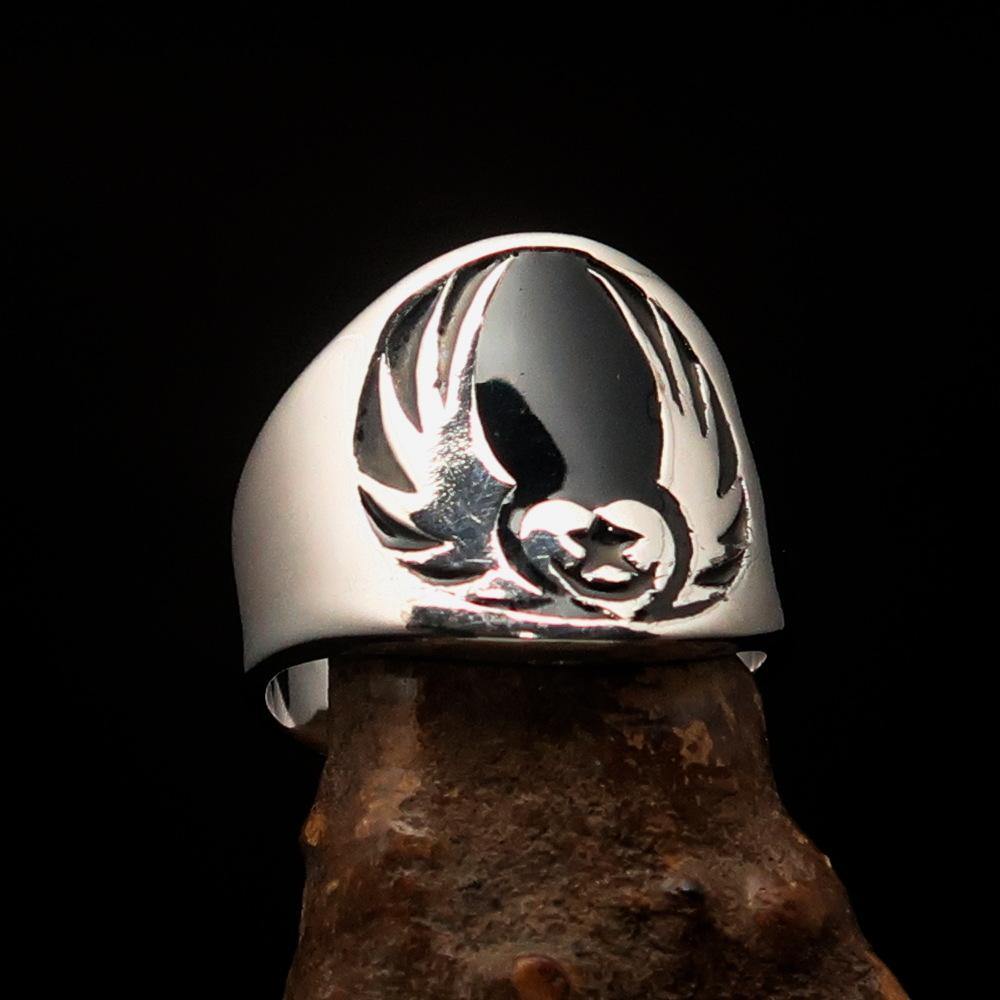 Men's Claddagh Ring featuring a black winged heart design, crafted from solid sterling silver with a high polished finish and enamel accents.