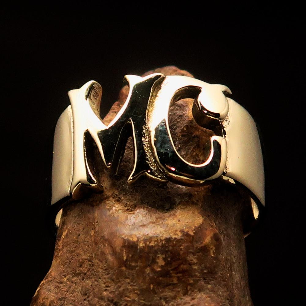 High polished solid brass Men's Costume Biker Ring with MC letters, showcasing its elegant design and craftsmanship.