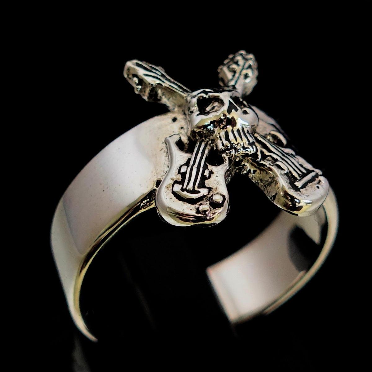 Men's Costume Skull Ring made of Sterling Silver featuring two crossed guitars and a skull design, showcasing an edgy and stylish look.
