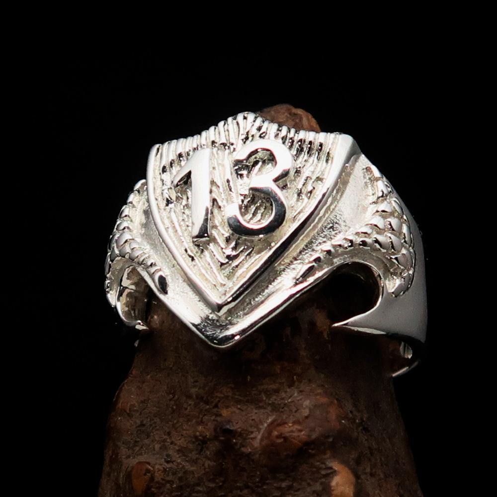 Men's Lucky Number 13 Shield Ring made of solid sterling silver with a high polished finish, showcasing its unique design and hallmark 925.