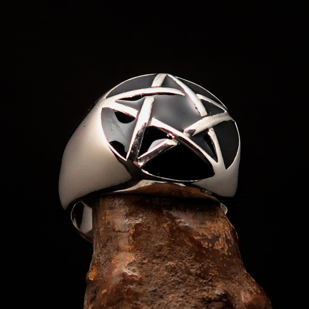 Men's sterling silver pinky ring featuring a domed black pentagram design, polished finish, and solid back.