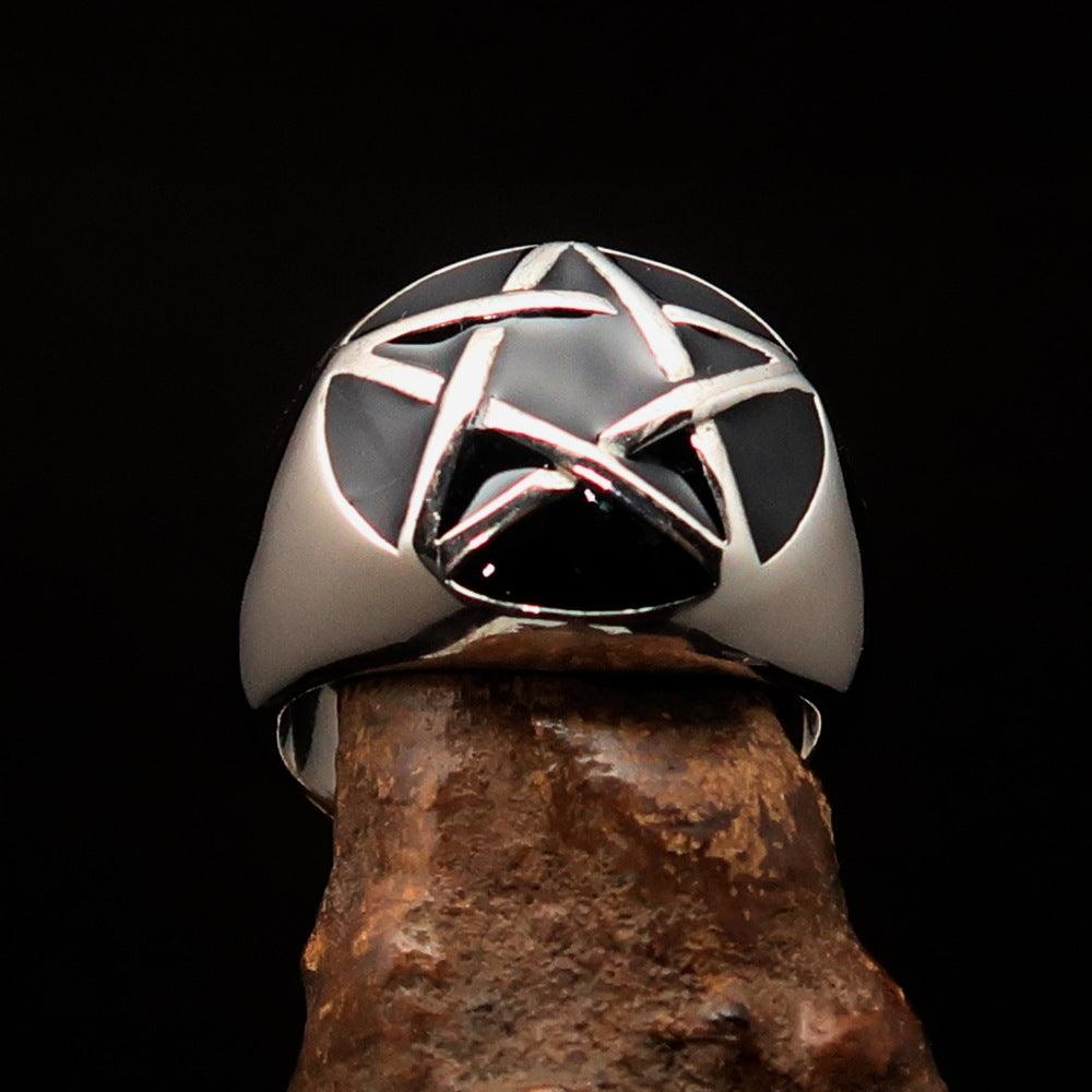 Men's sterling silver pinky ring featuring a domed black pentagram design, polished finish, and solid back.