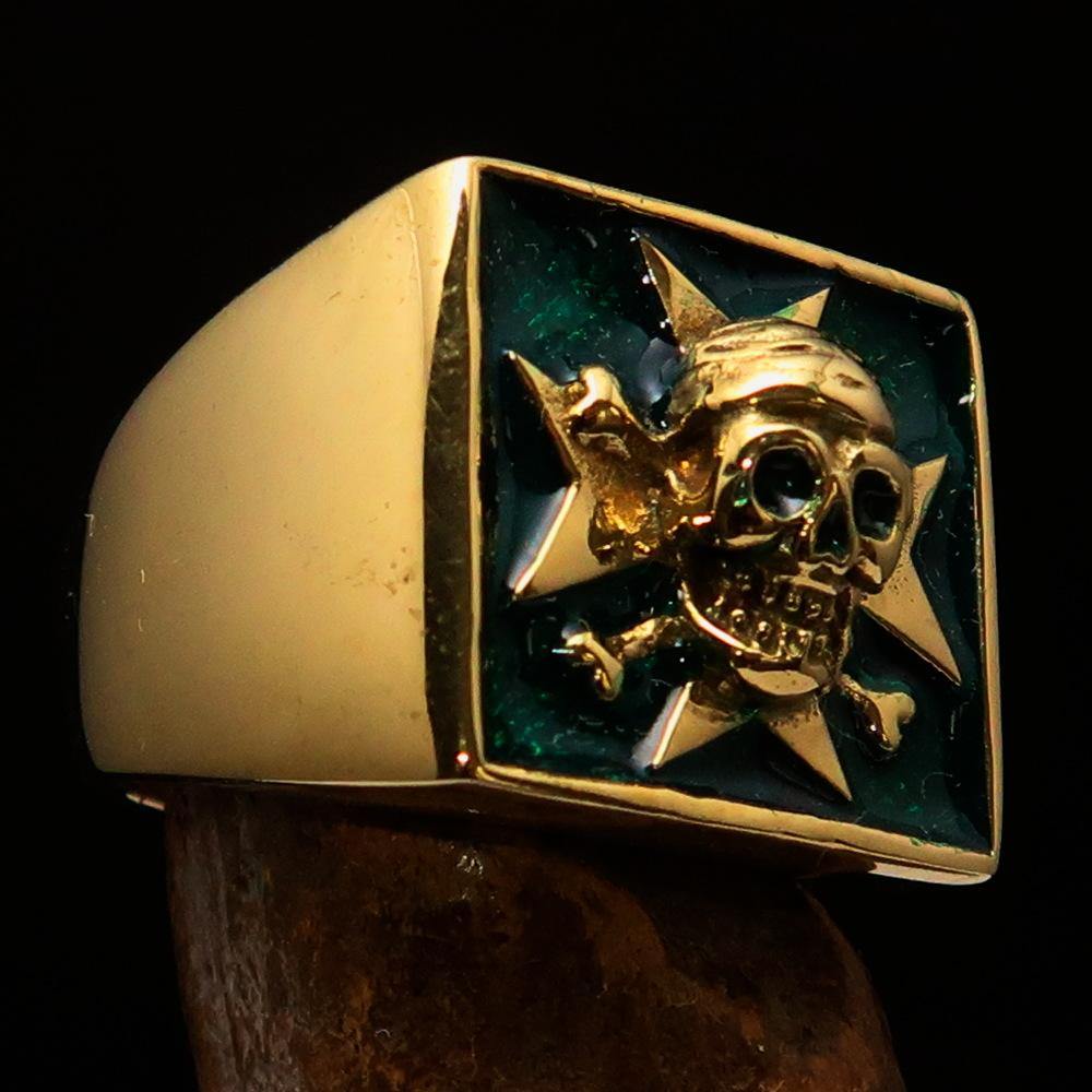 Men's Pirate Skull Ring made of solid brass with a green Maltese Cross, showcasing intricate details and a high polished finish.