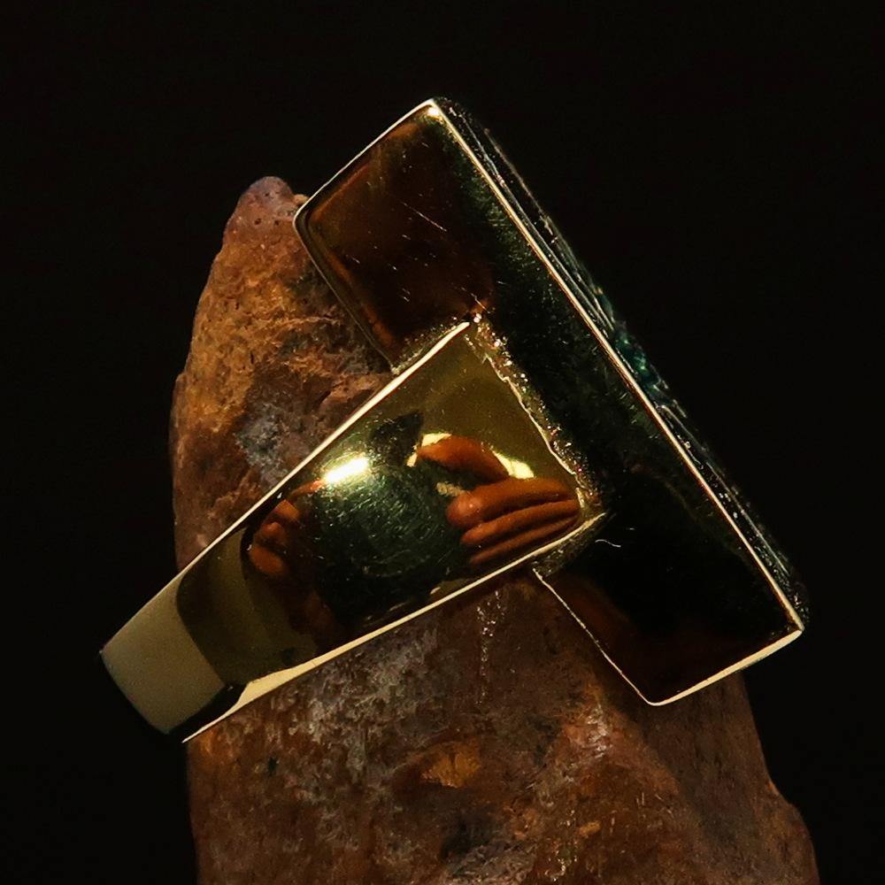 A beautifully crafted Men's Ring made of solid brass featuring a striking green Phoenix design, polished to a high shine.