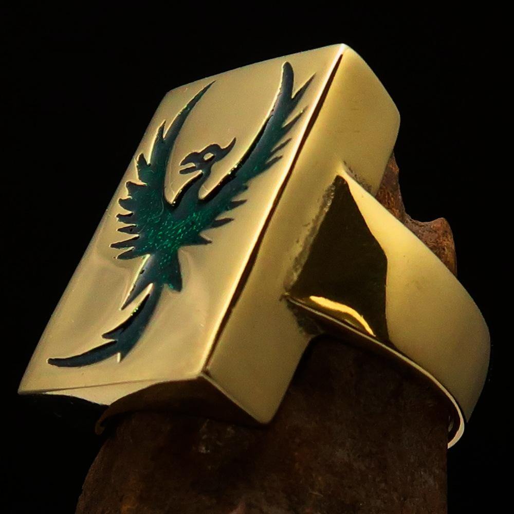 A beautifully crafted Men's Ring made of solid brass featuring a striking green Phoenix design, polished to a high shine.