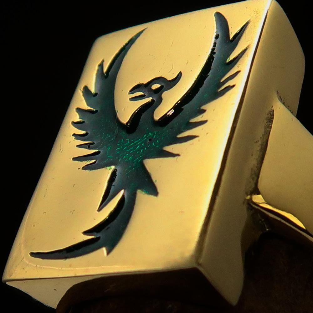 A beautifully crafted Men's Ring made of solid brass featuring a striking green Phoenix design, polished to a high shine.