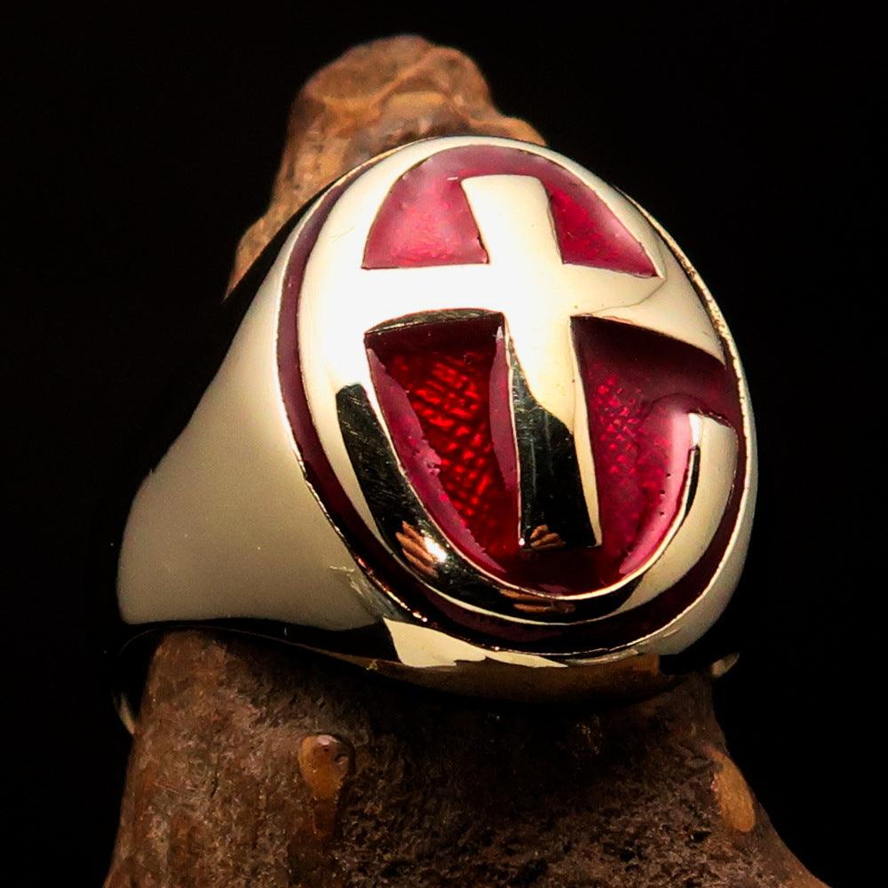 A high polished solid brass Men's Ring featuring a modern red Christian Cross design, showcasing its elegant craftsmanship and vibrant color.