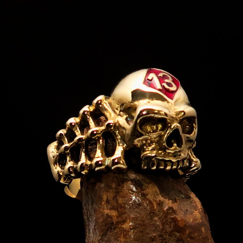 Men's Skull and Bones Ring in solid brass with red enamel Number 13 design, showcasing its unique craftsmanship and vibrant color.