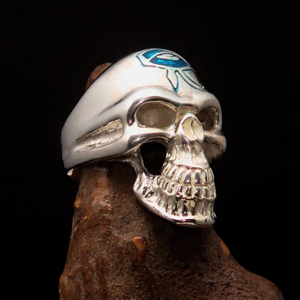 Men's Skull Ring made of sterling silver featuring a blue enamel Eye of Ra design, showcasing intricate details and a polished finish.