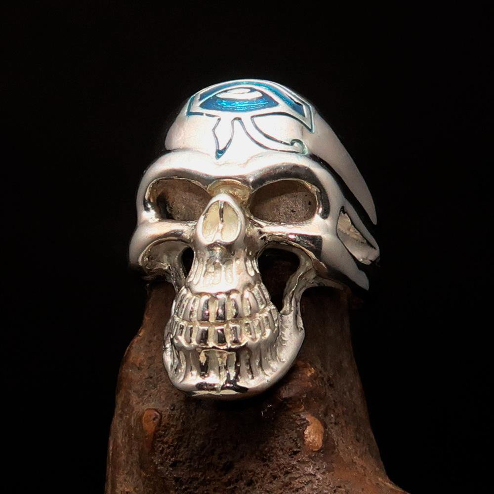 Men's Skull Ring made of sterling silver featuring a blue enamel Eye of Ra design, showcasing intricate details and a polished finish.