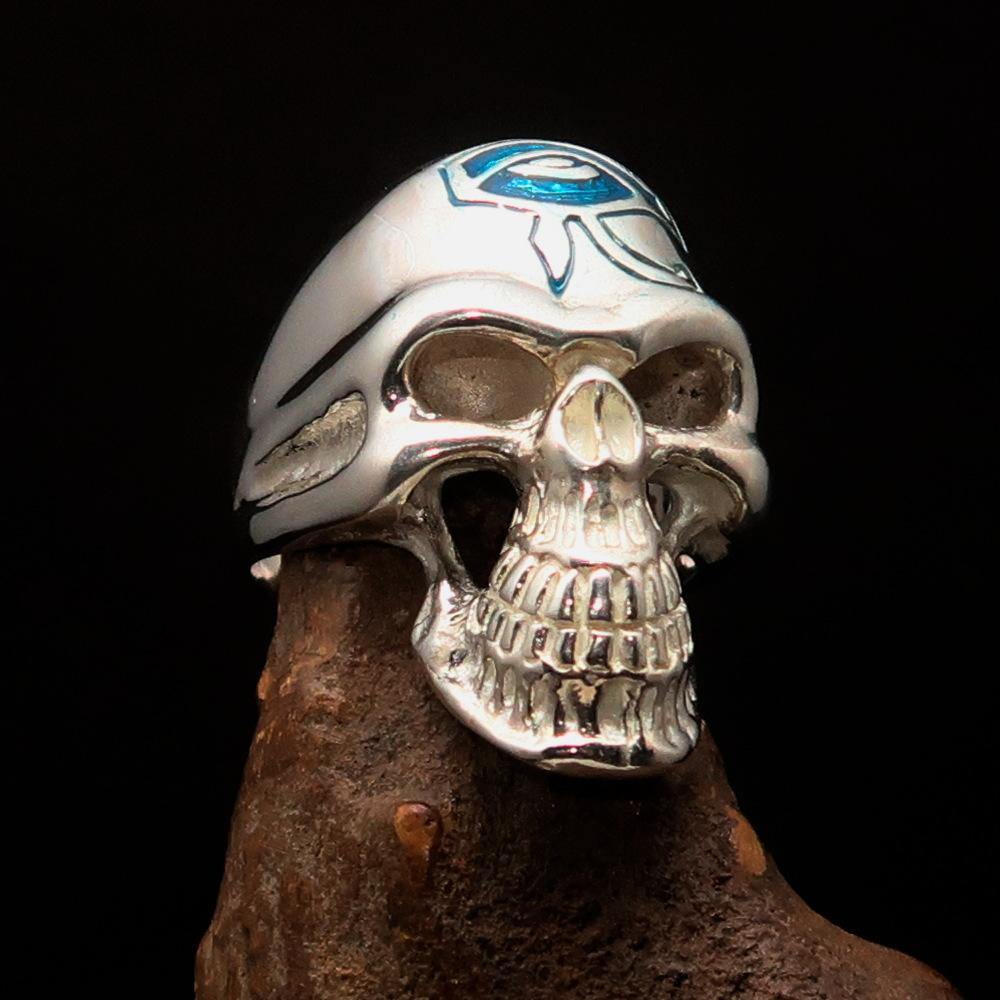 Men's Skull Ring made of sterling silver featuring a blue enamel Eye of Ra design, showcasing intricate details and a polished finish.