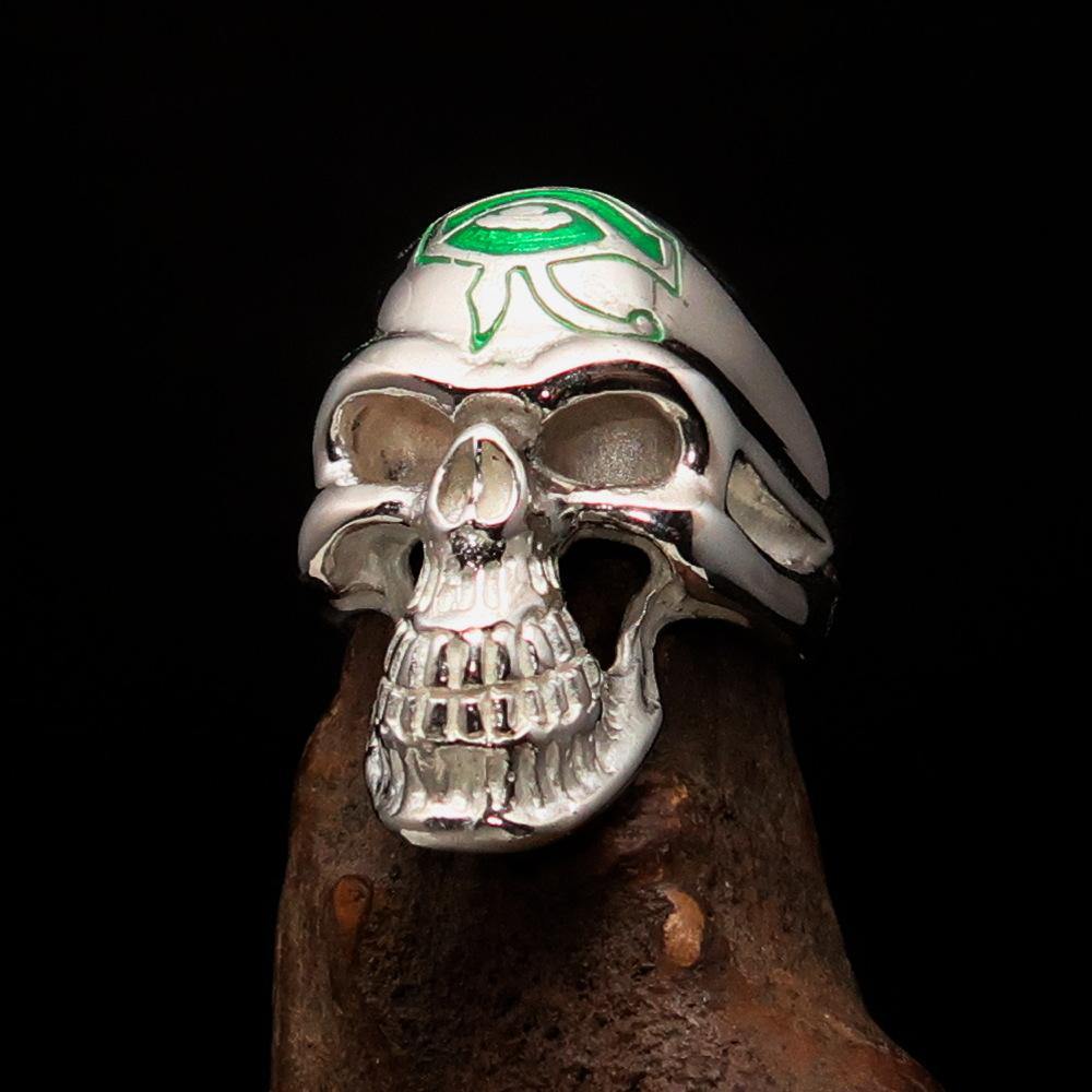 Men's Skull Ring made of sterling silver featuring a green Eye of Ra design, polished finish, and detailed craftsmanship.