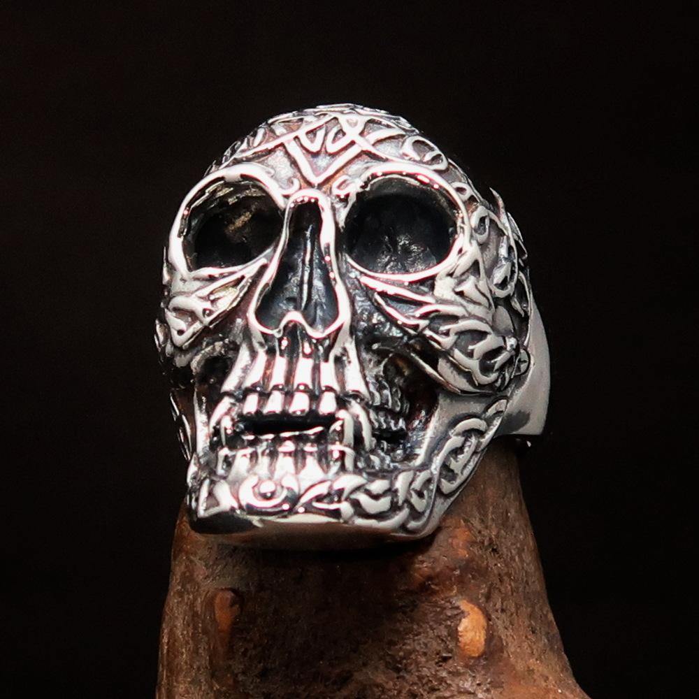 Men's sterling silver Celtic skull ring with intricate design and polished finish, showcasing its unique craftsmanship.