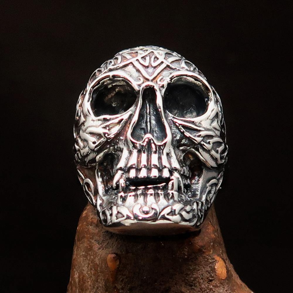 Men's sterling silver Celtic skull ring with intricate design and polished finish, showcasing its unique craftsmanship.