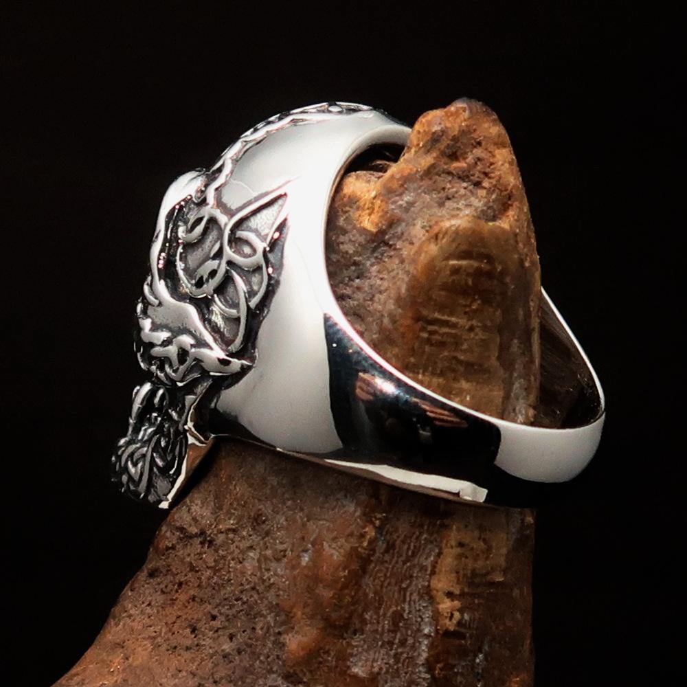 Men's sterling silver Celtic skull ring with intricate design and polished finish, showcasing its unique craftsmanship.