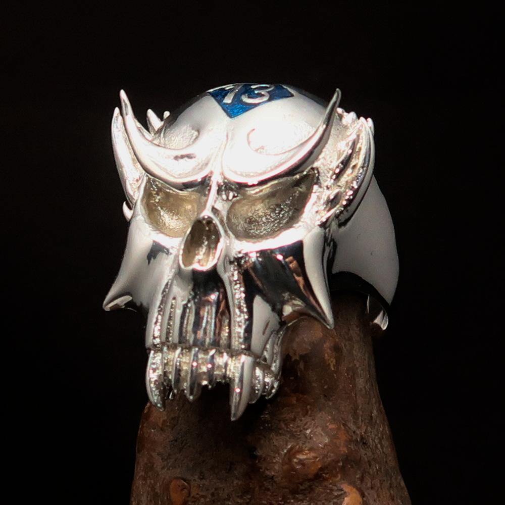 Men's Vampire Skull Ring made of sterling silver with a blue diamond accent, showcasing intricate craftsmanship and a high polished finish.