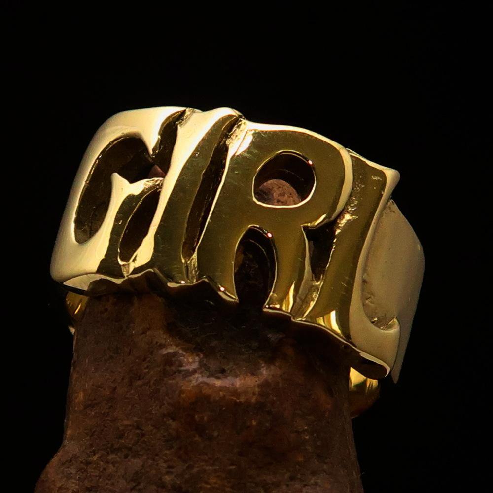 A high-polished solid brass One Word Girl Ring, showcasing its elegant design and 12 mm width.