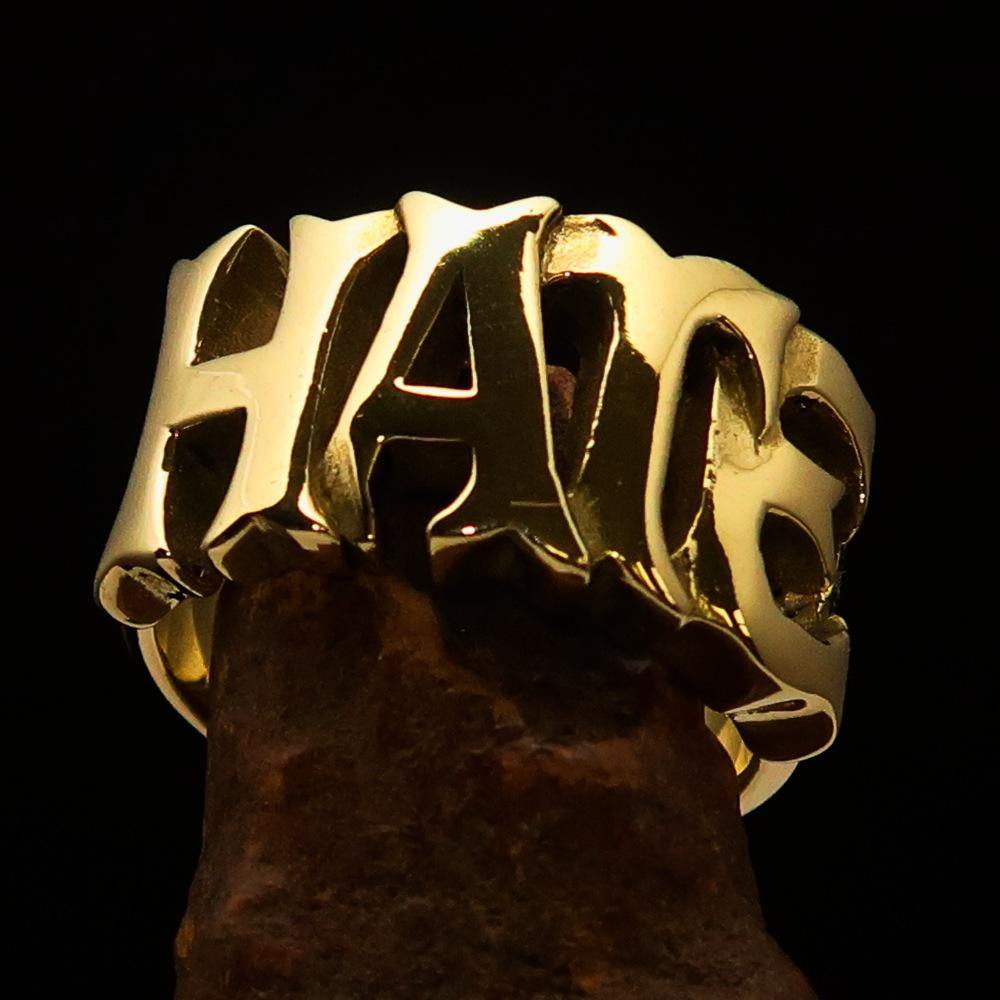 A high polished solid brass One Word Hate Ring, showcasing its sleek design and 14 mm width.