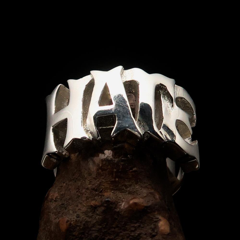 A beautifully crafted One Word Hate Ring made of high-polished sterling silver, showcasing its elegant design and hallmark 925.