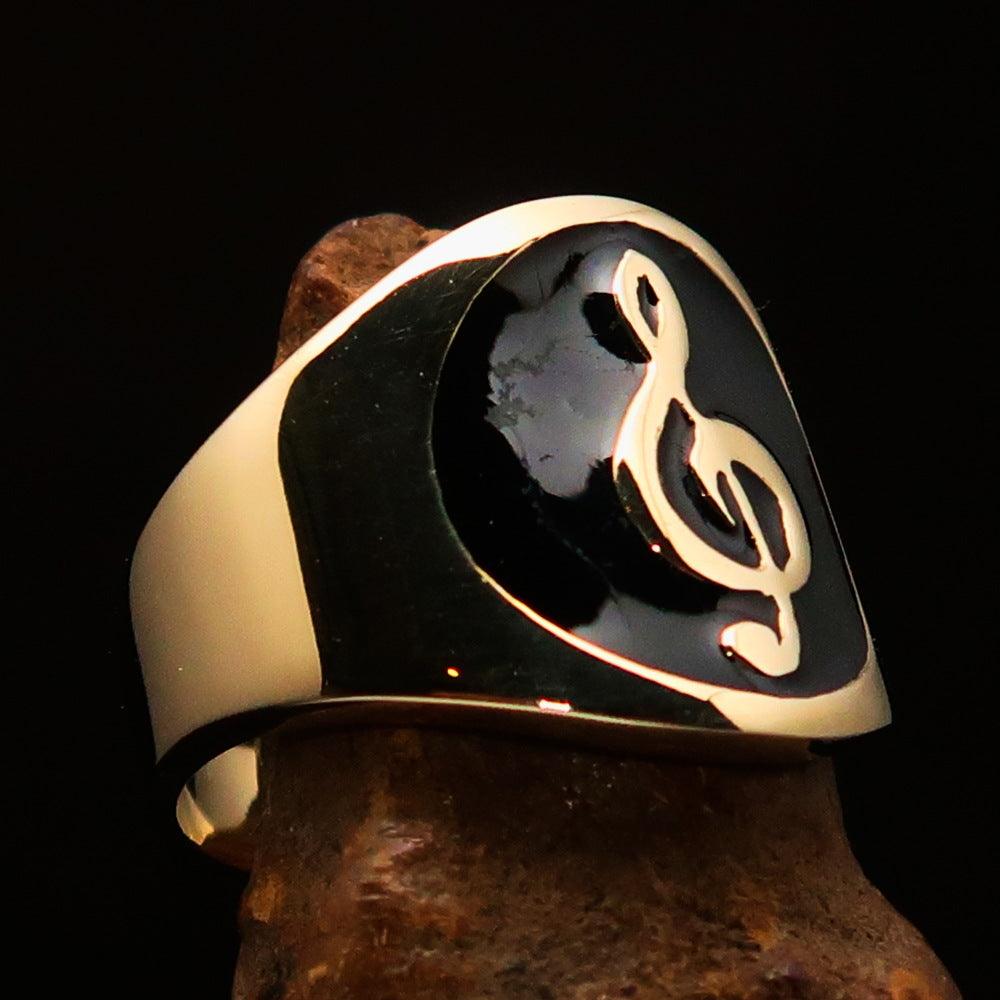 Men's black Treble Clef pinky ring made of solid brass with high-polished black enamel finish, showcasing a musical design.