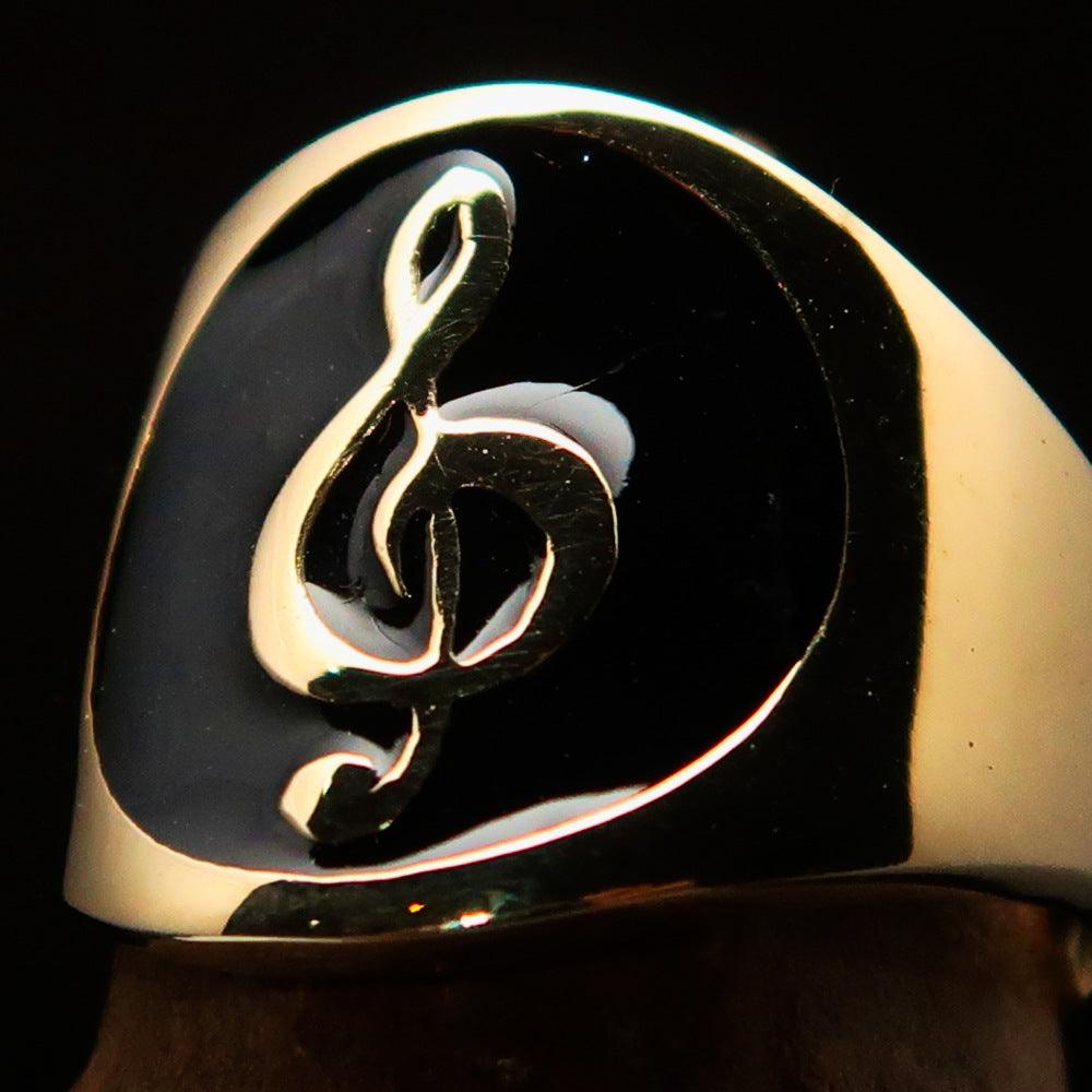 Men's black Treble Clef pinky ring made of solid brass with high-polished black enamel finish, showcasing a musical design.