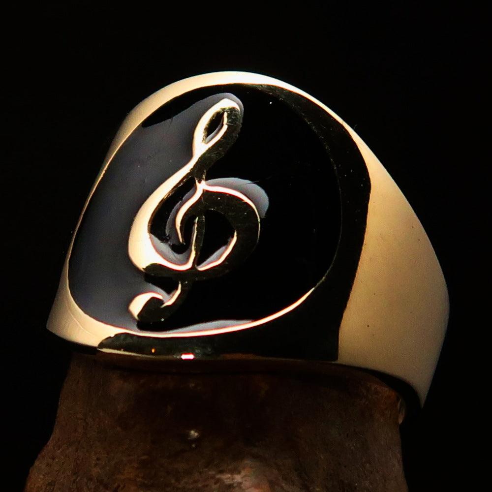 Men's black Treble Clef pinky ring made of solid brass with high-polished black enamel finish, showcasing a musical design.