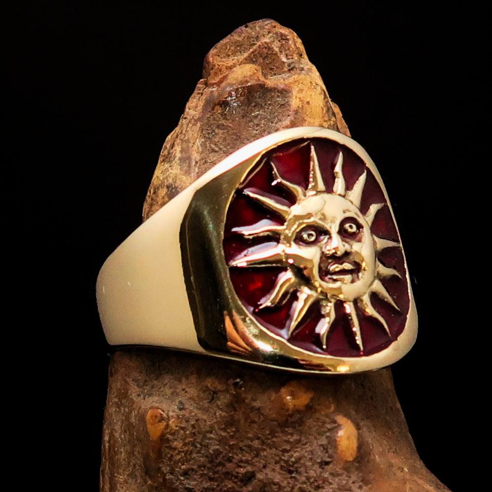 Men's Inca Sun Aztec Pinky Ring in solid brass with shiny red enamel finish, showcasing intricate design and polished surface.
