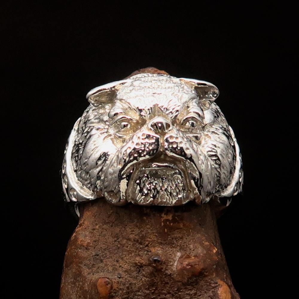 A shiny sterling silver men's ring featuring a detailed bulldog design, showcasing its craftsmanship and polished finish.