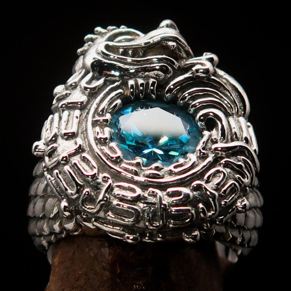 A beautifully crafted sterling silver men's ring featuring an intricate ancient Maya Inca dragon design with a vibrant blue cubic zirconia stone.