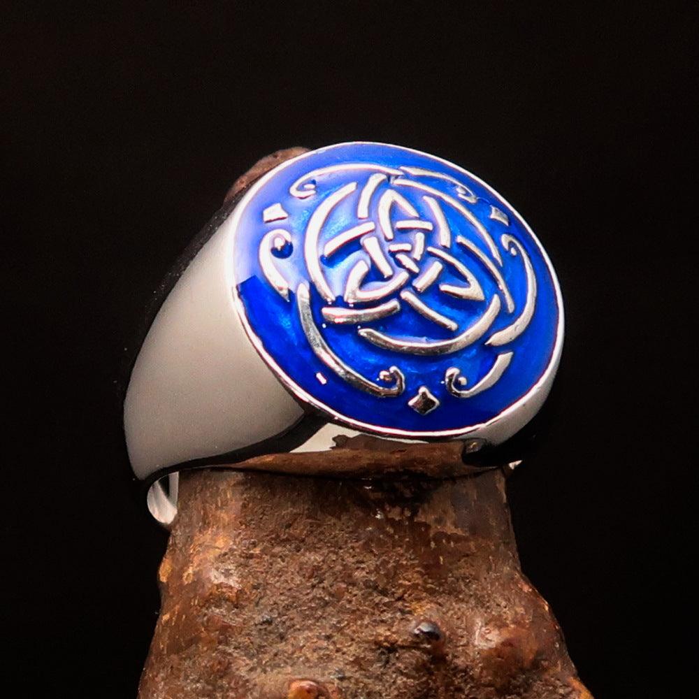 A beautifully crafted domed men's ring featuring a blue Celtic Triquetra Knot design, made of solid sterling silver with a high-polished finish.