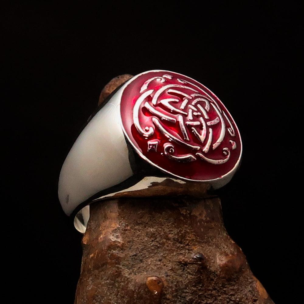 A beautifully crafted sterling silver men's ring featuring a red Celtic Triquetra Knot design, polished to a high shine.