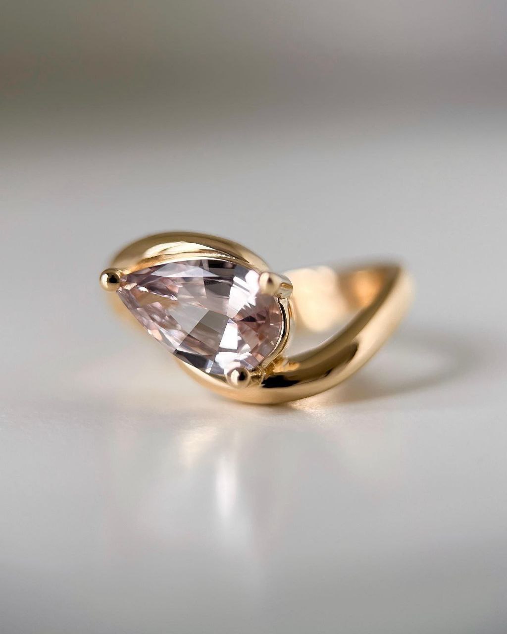 Gold plated silver ring featuring a pear-shaped natural pink zircon stone, elegantly designed for women.