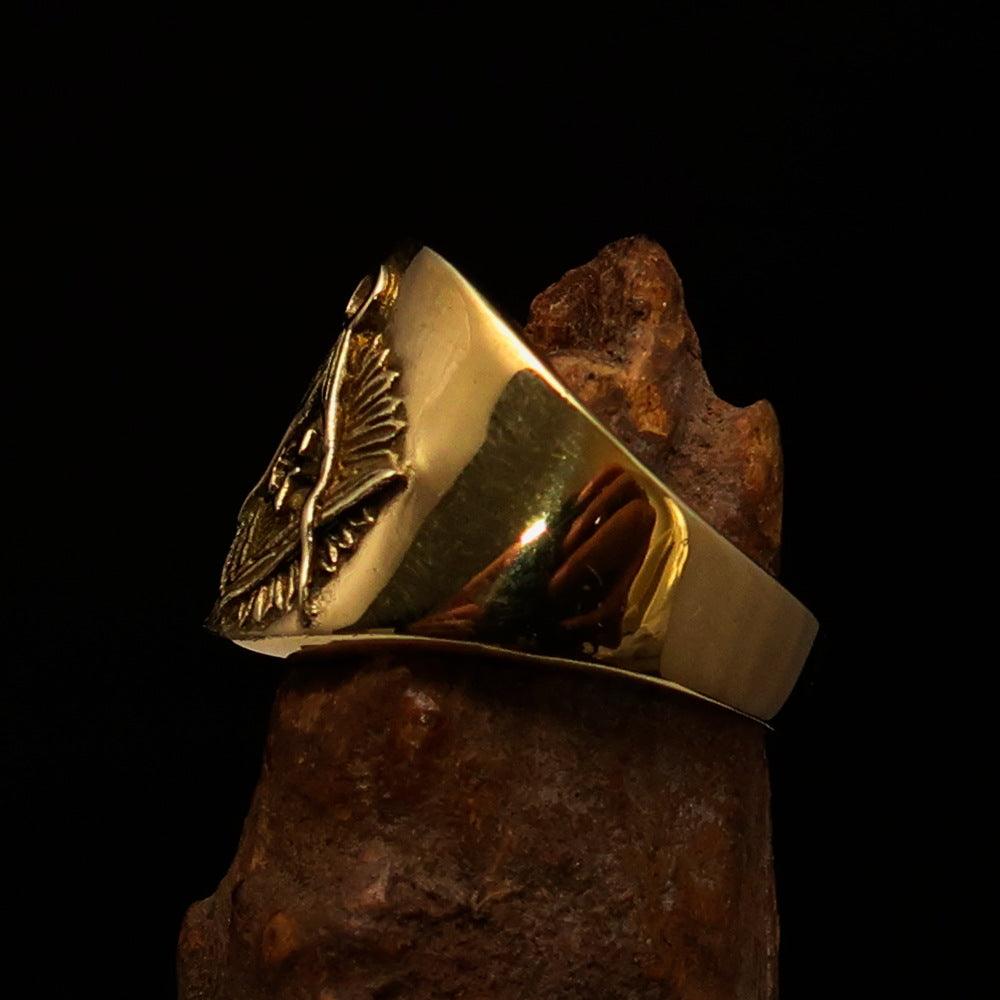 Men's shiny brass Masonic pinky ring featuring square and compasses symbol, polished finish, and available in multiple sizes.