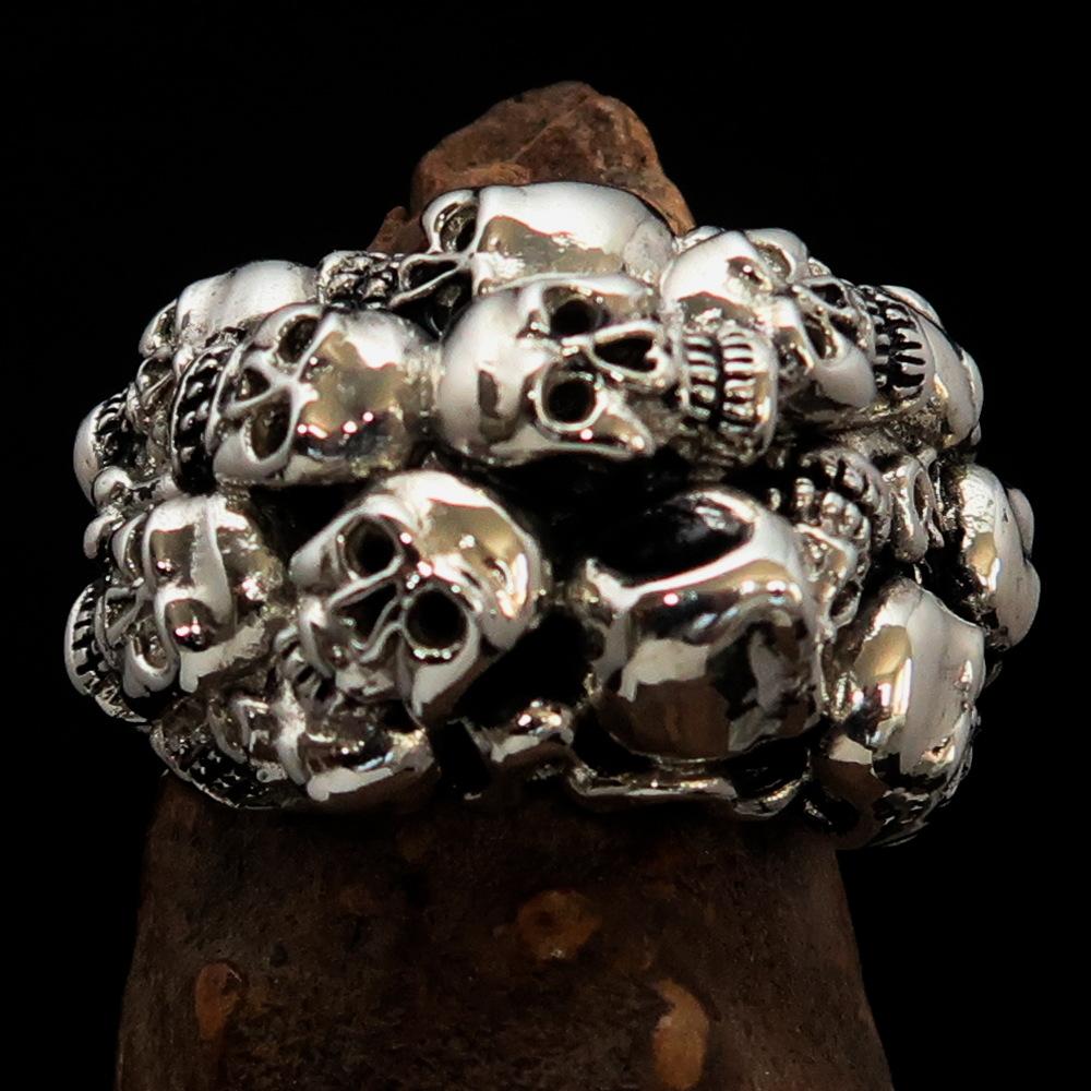 Men's sterling silver biker ring featuring 13 skulls with a high polished and antiqued finish, showcasing intricate details.