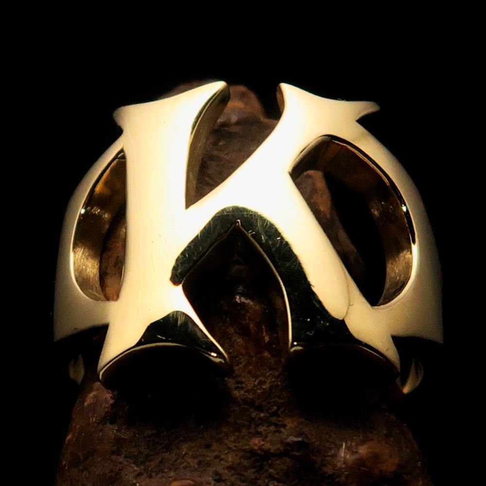 Mirror polished men's brass initial ring featuring a bold letter K, showcasing its elegant design and high polish finish.