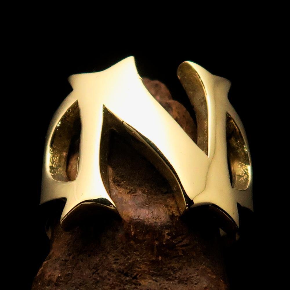 Mirror polished men's brass initial ring with bold letter N, showcasing a sleek and stylish design.