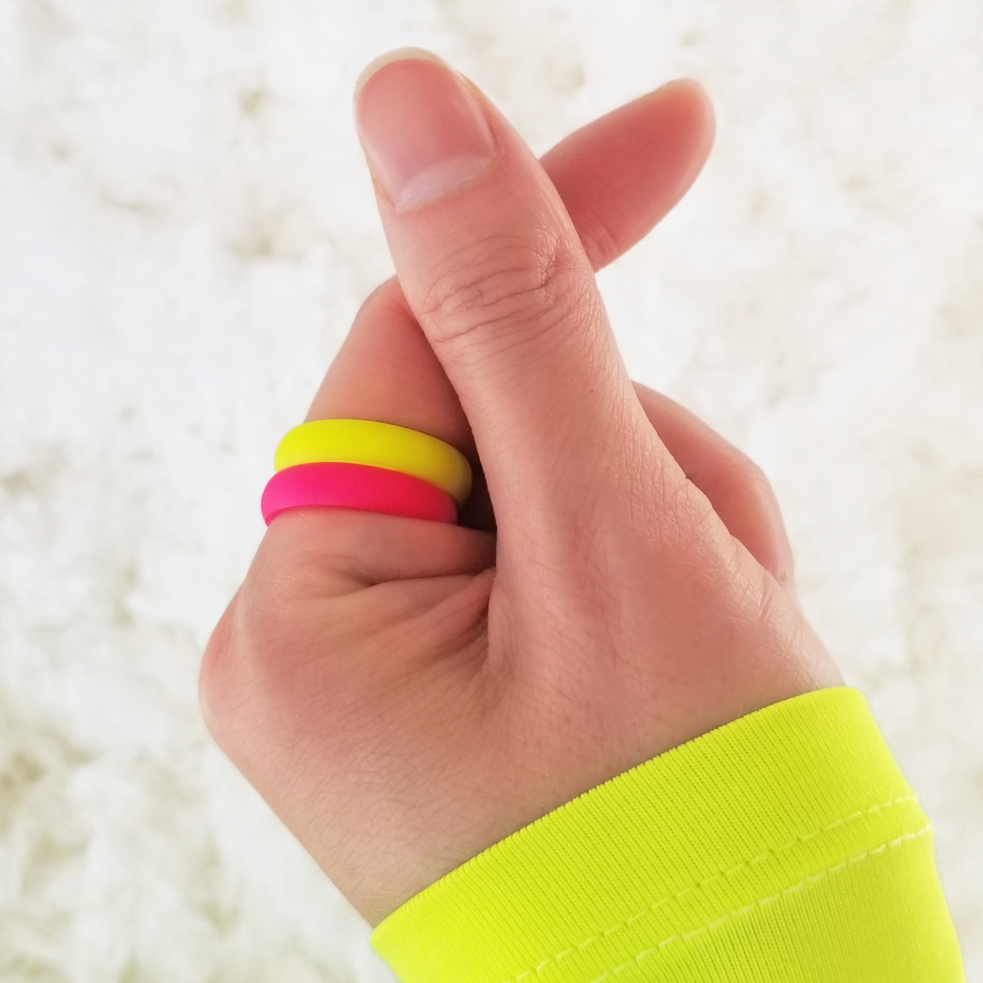Neon hot pink breathable silicone ring with a sleek bevel design, showcasing its smooth surface and ergonomic fit.