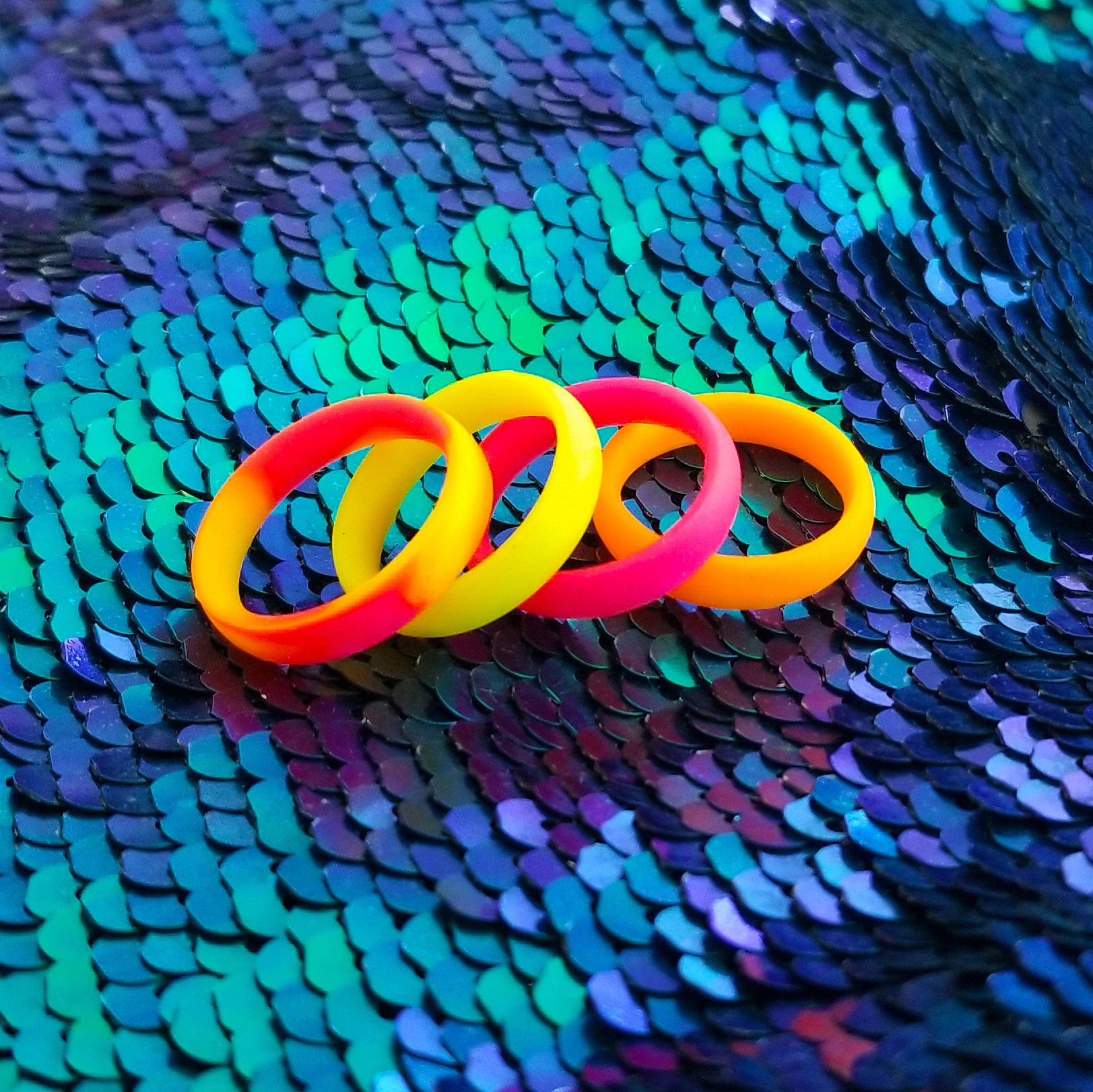 Neon hot pink breathable silicone ring with a sleek bevel design, showcasing its smooth surface and ergonomic fit.