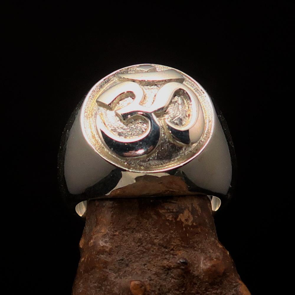 Men's Buddhist ring featuring the Aum symbol, crafted in two-tone matte sterling silver, showcasing its elegant design and quality craftsmanship.