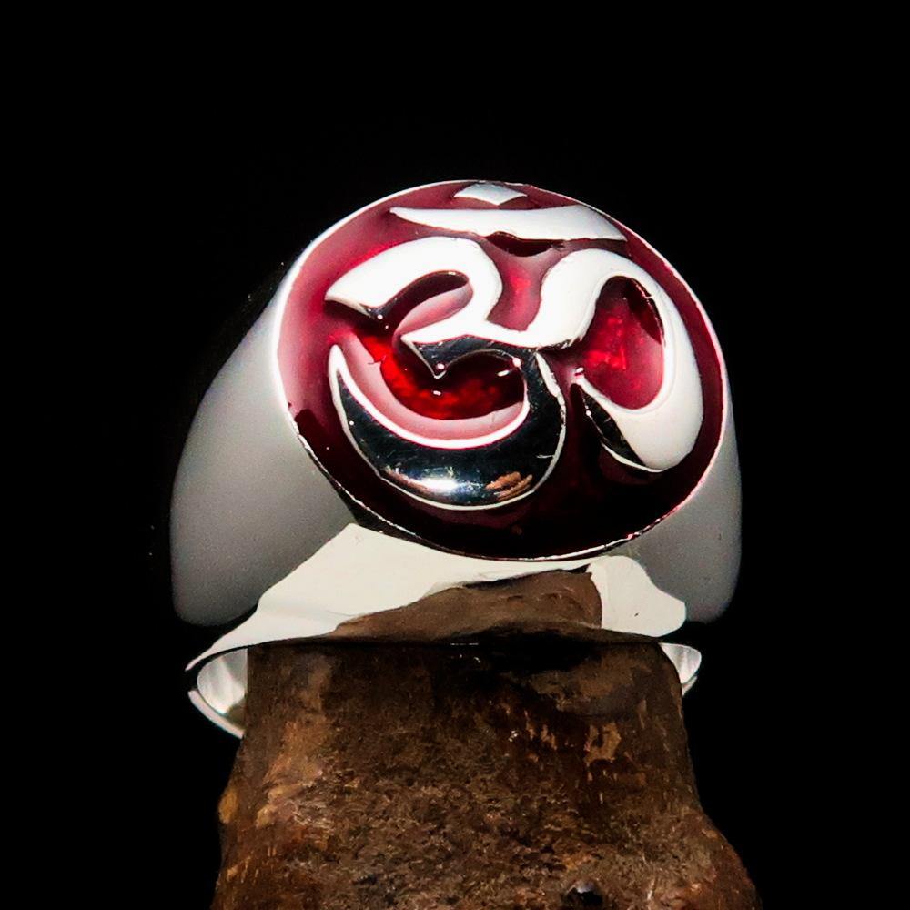 Men's sterling silver Buddhist ring featuring a red Aum symbol, high polished with enamel finish, showcasing its elegant design.
